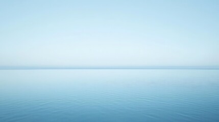 Obraz premium Serene Waters Under a Pale Blue Sky