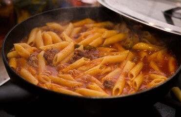 authentic photo of home pasta bolognese in the pan
