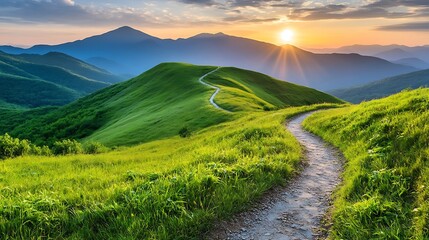 Fototapeta premium Winding Path Through Lush Green Mountain Landscape Sunset