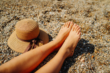 Young caucasian woman is going to the beach with straw bag	