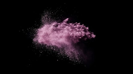 Obraz premium Floating cloud of pink powder explosion against a black background
