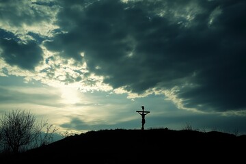 Fototapeta premium silhouette of Jesus on the cross against an ominous sky, symbolizing his sacrifice and majesty during Easter.