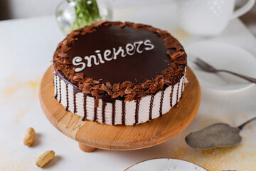 Snickers cake with caramel, peanuts and buttercream.