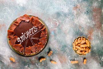 Snickers cake with caramel, peanuts and buttercream.