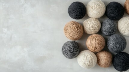 A collection of different colored yarn balls on a white background