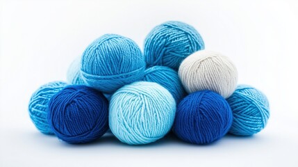 A pile of blue and white yarn balls