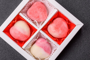 Delicious sweet mochi in the shape of red hearts
