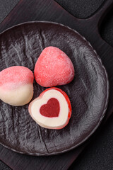 Delicious sweet mochi in the shape of red hearts