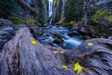 A waterfall in Colorado during peak fall colors
