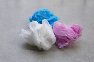 Colorful garbage bags on the tiled floor