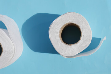 Toilet paper on blue background.