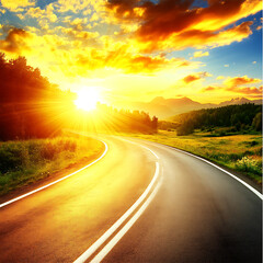 Fototapeta premium A winding asphalt road reflects the golden light of a vibrant sunset over a landscape of trees and distant mountains.