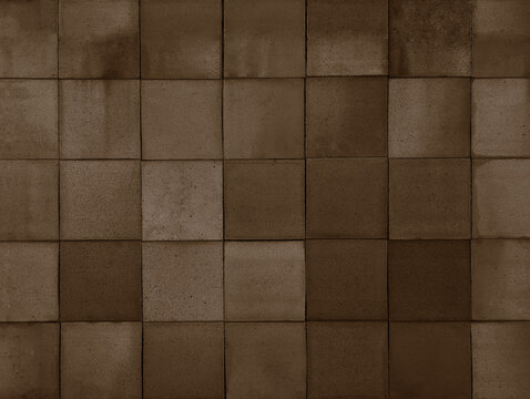 Dark mocca brown terracotta ceramic tiles cladding texture for interior, exterior wall, dividing wall, facade, yard, floor. Natural handmade grey tinted outdoor square clay slabs background.