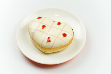 Heart Shaped Donut with Pink Icing on Plate