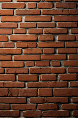 Obraz premium Rustic Brick Wall Texture: A close-up shot of a weathered brick wall, showcasing the intricate details of its construction and the rich hues of the aged brick.