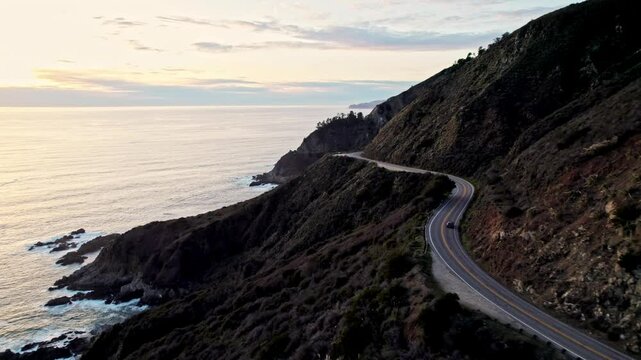 Epic Drone View of California&rsquo;s Pacific Coast Highway Winding Along Steep Cliffs and Ocean