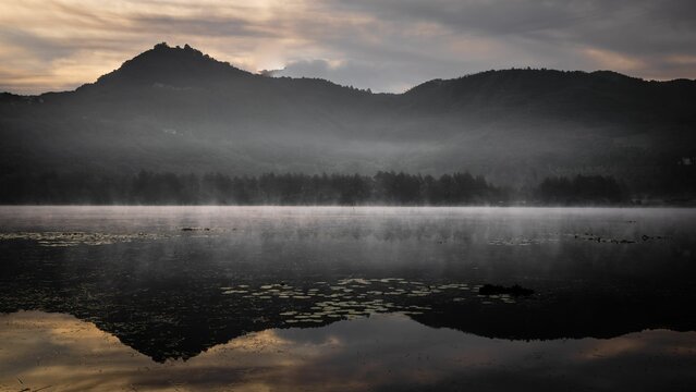 The Fimon Lake at Dawn with Mountains in Italy