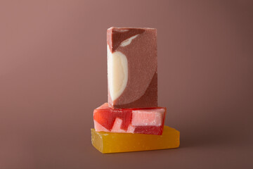  Natural multi-colored solid handmade soap a mocha mousse background. Eco-friendly natural handmade cosmetics. Natural spa products and decor for bath.Color 2025