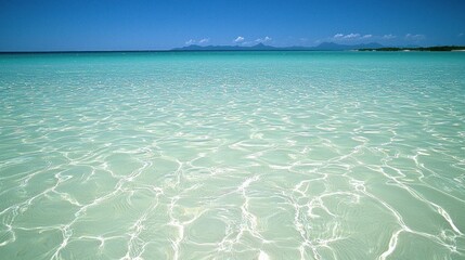 Tranquil turquoise shallows, azure sky, distant islands, perfect beach