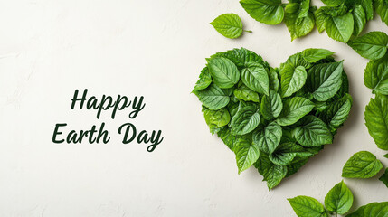 A heart-shaped leaf with the words “Happy Earth Day” on a light background, symbolizing love of nature and care for the environment.