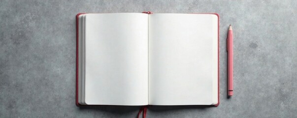 A blank notebook lies open on a grey surface, revealing its empty pages , paper, white space, study