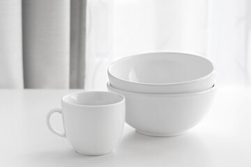 white plates and a cup on the table