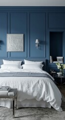 Elegant modern bedroom with blue accent wall and cozy white bedding
