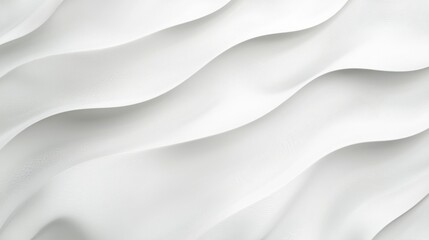 Fototapeta premium This image features an abstract design of soft, flowing white waves against a pale background, creating a serene and calming atmosphere.