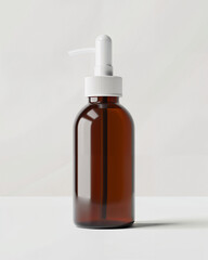 Fototapeta premium Brown glass bottle with white pump top on a light background showcasing minimalistic and modern design