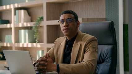 African American businessman ethnic puzzled man employer manager CEO entrepreneur working with...