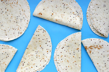 Quinoa tortilla wraps on blue background