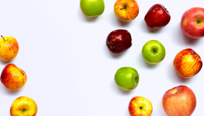 Variety of fresh apples on white background.