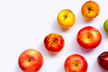 Variety of fresh apples on white background.