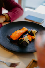 food a piece of salmon and vegetables on a plate. suitable for a healthy breakfast