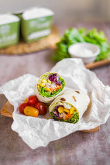vegetables wrapped in kebab skin and placed on a plate