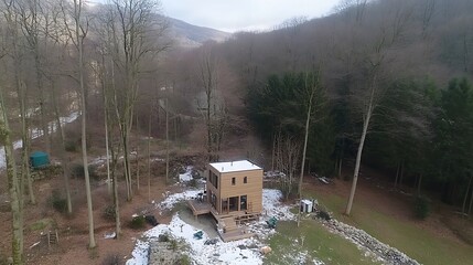 Modern house, winter woods, aerial view, secluded