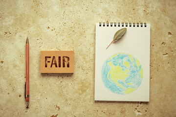 There is sticky note with the word FAIR. It is as an eye-catching image.
