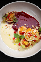 Fried cheesecakes with sauce and pieces of fruit