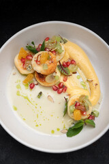 Fried cheesecakes with sauce and pieces of fruit