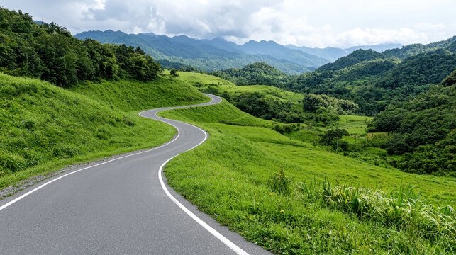 Winding road through green hills and mountains