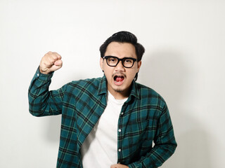Asian man looking to the camera and showing angry expression isolated on white background