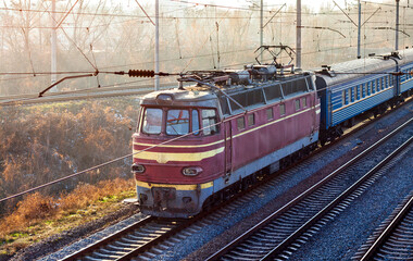 Old Czech electric locomotive with a passenger train in Kyiv, Ukraine