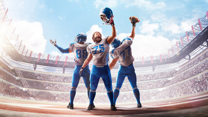 American Football. American football players celebrate a victory in a large stadium. The stands are full of fans. Sports banner for bookmakers. Sports victory