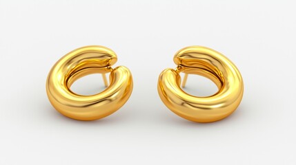 Gold hoop earrings on white background