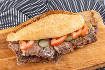Meat doner between bread on a wooden plate. Traditional Turkish cuisine doner. Meat doner between...