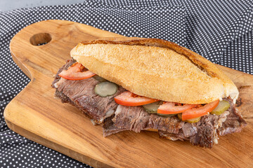 Meat doner between bread on a wooden plate. Traditional Turkish cuisine doner. Meat doner between...