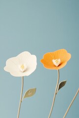 Fototapeta premium Decorative Paper Flowers on Light Blue Background for Design Purposes