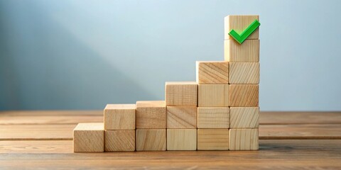Wooden blocks forming an ascending staircase culminating in a green checkmark symbolizing achievement and success in a project or goal.