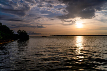 sunset in South America with the sun giving a golden touch to the water. Landscape in Colombia