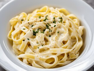 Creamy Fettuccine Alfredo Pasta Topped with Parsley and Black Pepper